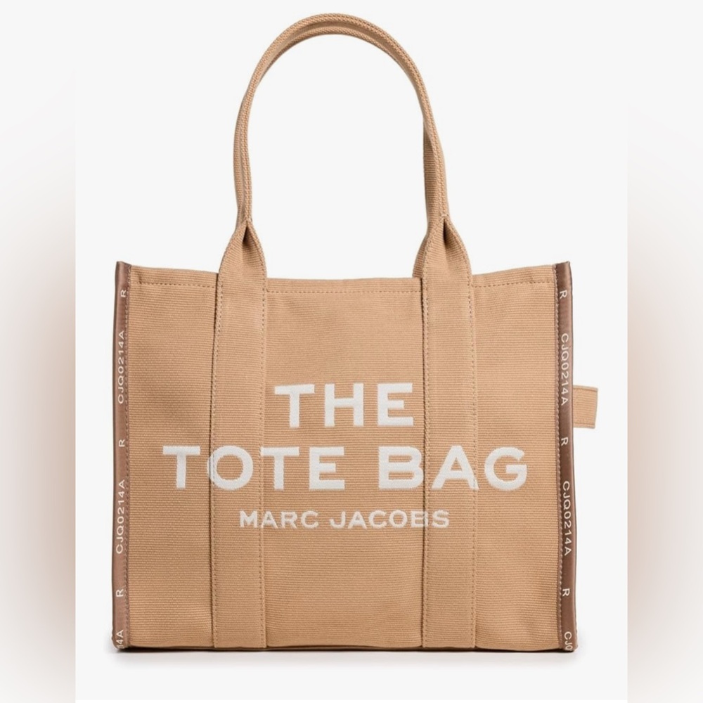 Marc Jacobs Brown Canvas Tote 
Used one time.
Like new - medium 
Perfect size